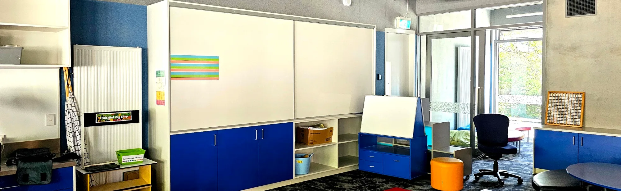 Prowite cabinet mounted sliding whiteboards in classroom storage cabinet at Arthur St school