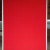 pinboard in bright red fabric, aluminium framed