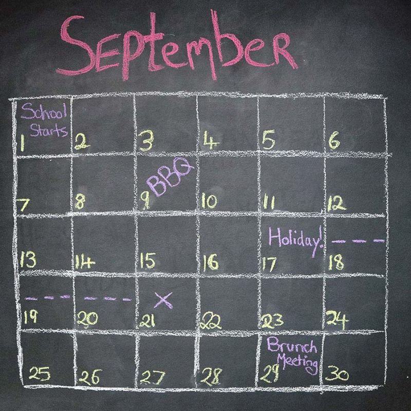 September calendar written on chalkboard painted wall planning blackboard paint