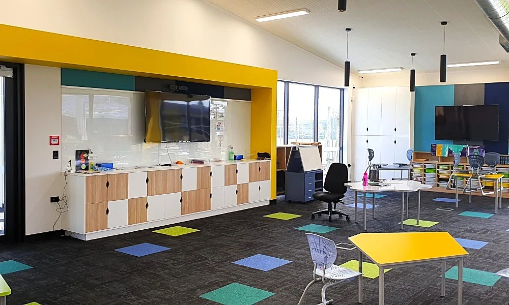 Children's vibrant learning centre with glass whiteboard and screens